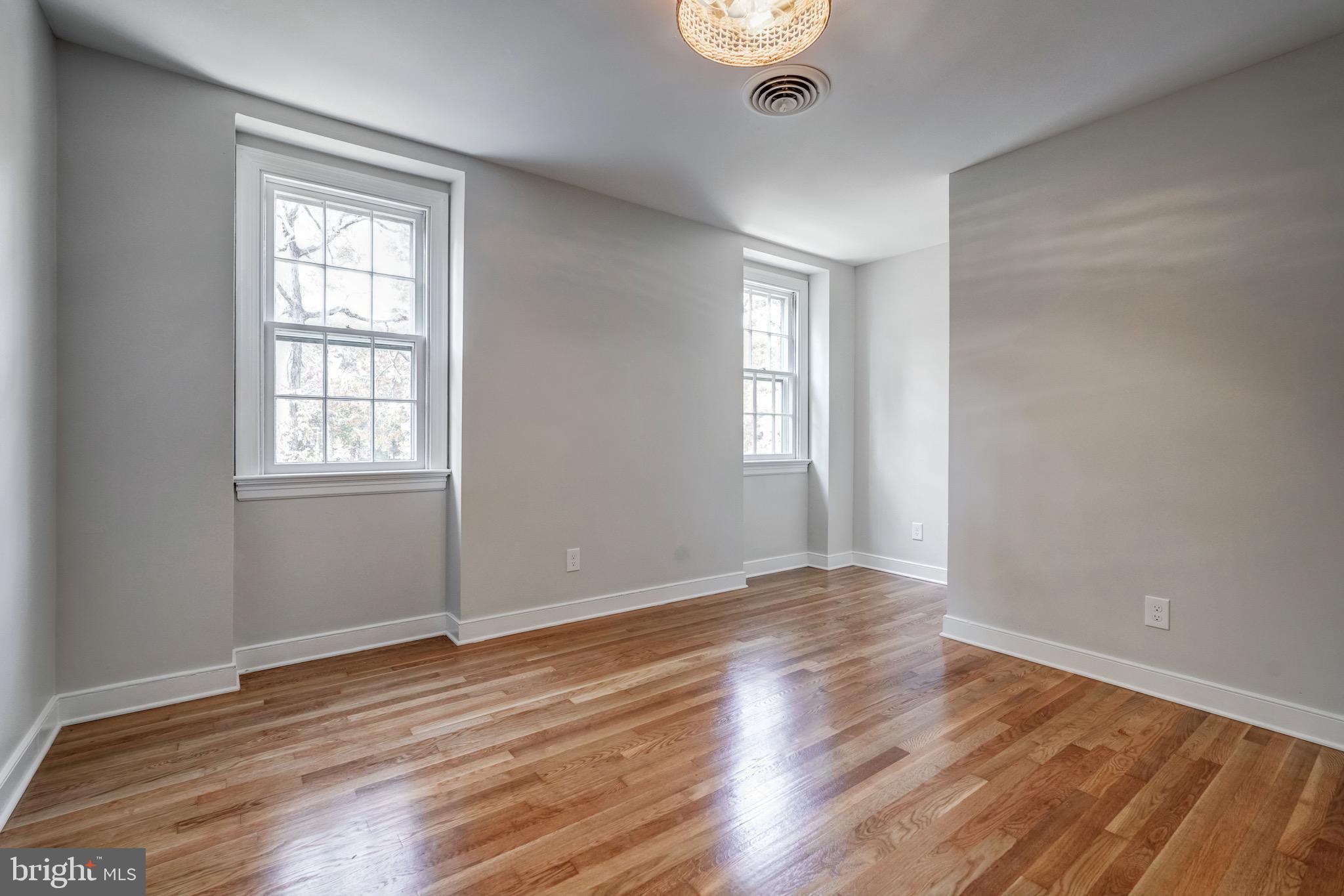 1771 Robindale Road North Chesterfield, VA 23235 - Photo 52 of 67 a view of an empty room with wooden floor and a window
