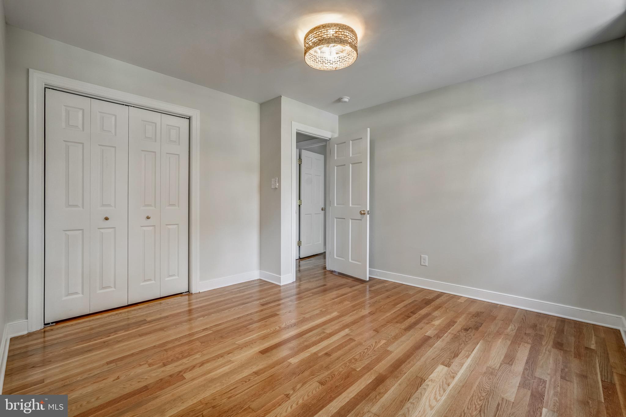 1771 Robindale Road North Chesterfield, VA 23235 - Photo 53 of 67 a view of an empty room with wooden floor and a window