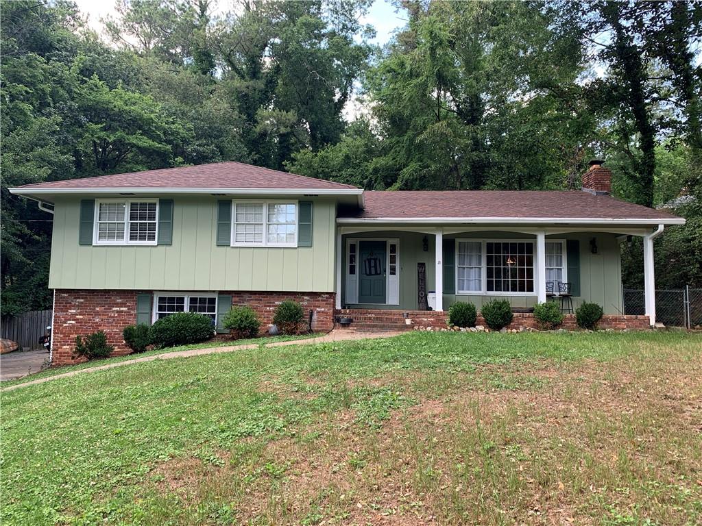 11 Mitchell Circle Southeast Rome, GA 30161 - Photo 1 of 1 a front view of a house with a yard and porch