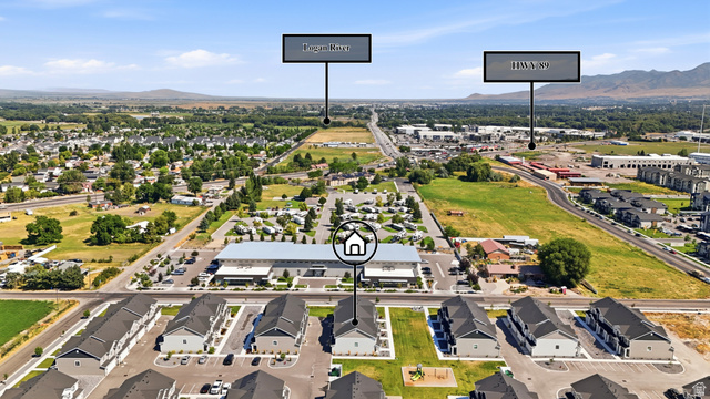 2216 South 1150 West Nibley, UT 84321 - Photo 8 of 34 Aerial perspective showcasing a modern residential development with a mountain backdrop