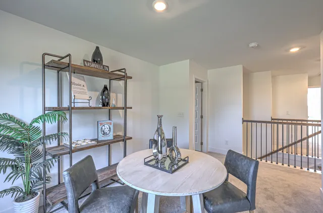 a view of a livingroom with furniture and window