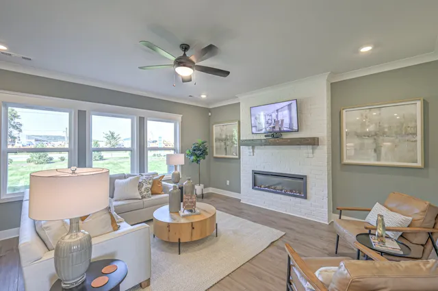 a living room with furniture and a fireplace