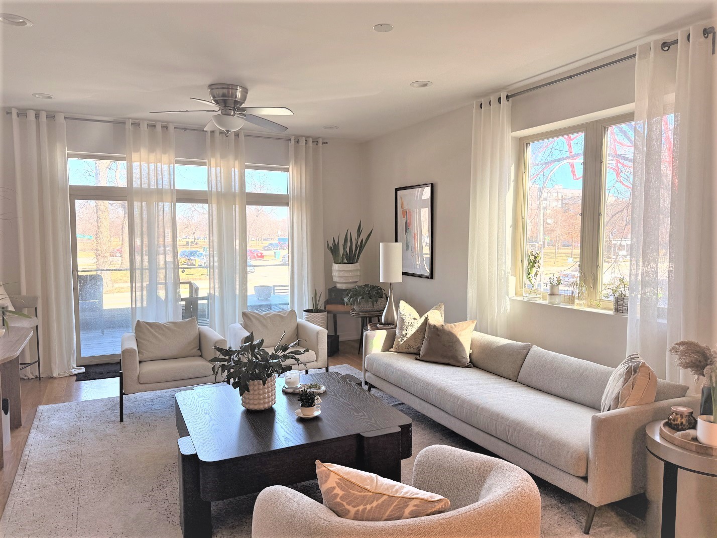 2835 West Division Street, Unit 2E Chicago, IL 60622 - Photo 2 of 33 a living room with furniture and large windows