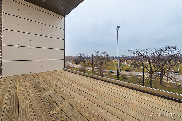 2835 West Division Street, Unit 2E Chicago, IL 60622 - Photo 29 of 33 a view of a balcony with wooden floor