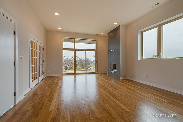 2835 West Division Street, Unit 2E Chicago, IL 60622 - Photo 5 of 33 wooden floor in an empty room with a window