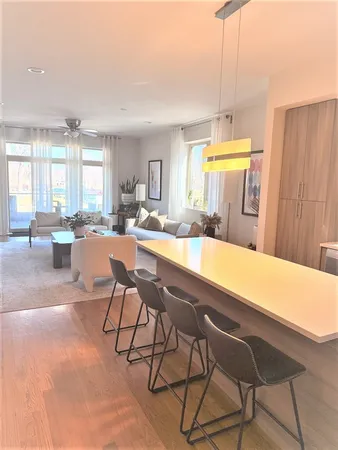 a living room with a table and chairs