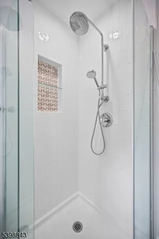a bathroom with a glass shower door