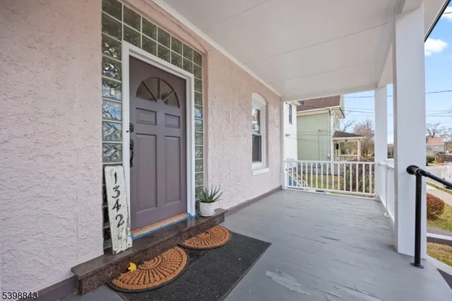 a view of a livingroom with wooden floor and a window