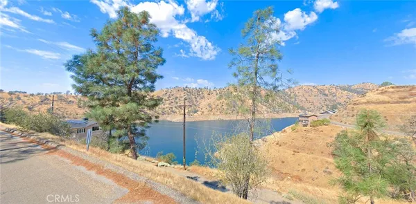 a view of a house with a snow in the background