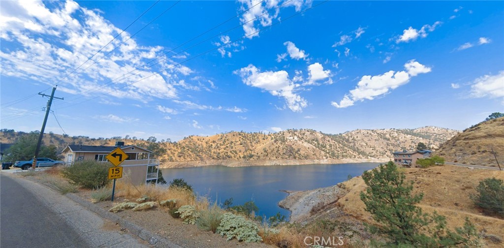 28075 Sky Harbour Road Friant, CA 93626 - Photo 3 of 4 a view of a lake with a mountain