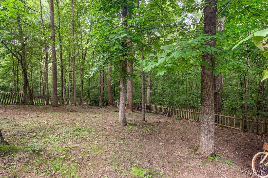 6903 Pointer Ridge Road Midlothian, VA 23112 - Photo 23 of 23 a view of outdoor space with trees