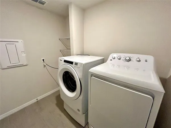 a utility room with dryer and washer