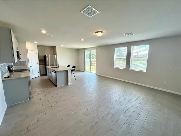 a view of a kitchen with a sink cabinets and a living room