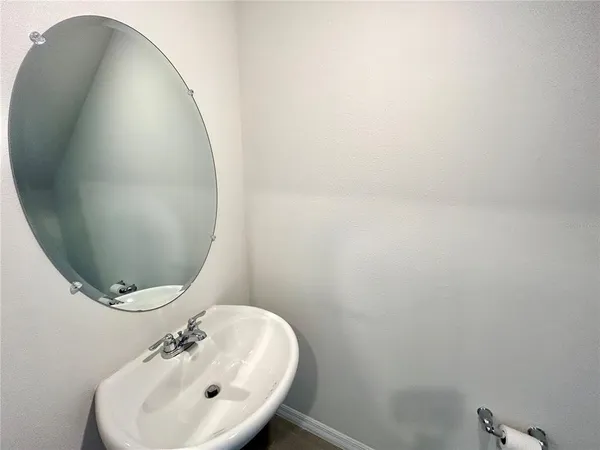 a bathroom with a sink and mirror
