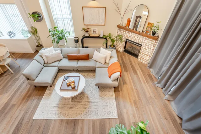 an aerial view of a house with a swimming pool and outdoor space
