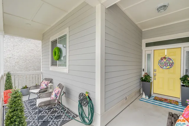 a kitchen with stainless steel appliances granite countertop a stove and white cabinets