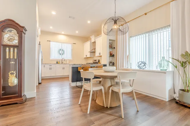 a living room with a bed and a window