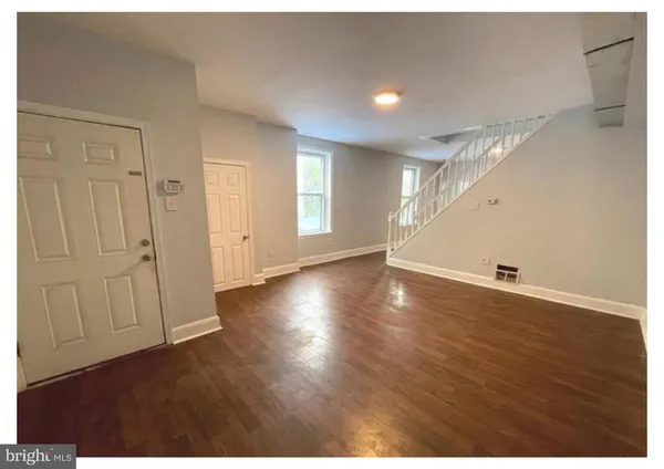 a view of a livingroom with wooden floor