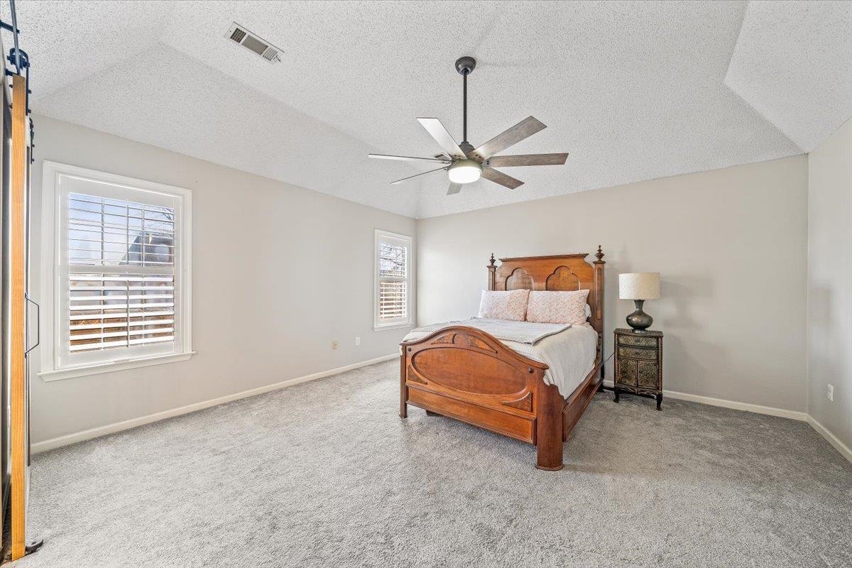 3204 Falling Star Cove Bartlett, TN 38134 - Photo 18 of 36 a living room with a bed furniture and a window