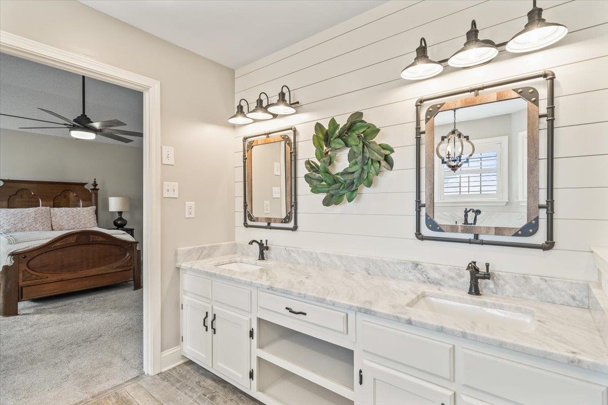 3204 Falling Star Cove Bartlett, TN 38134 - Photo 20 of 36 a en suite bathroom with a granite countertop sink and a mirror