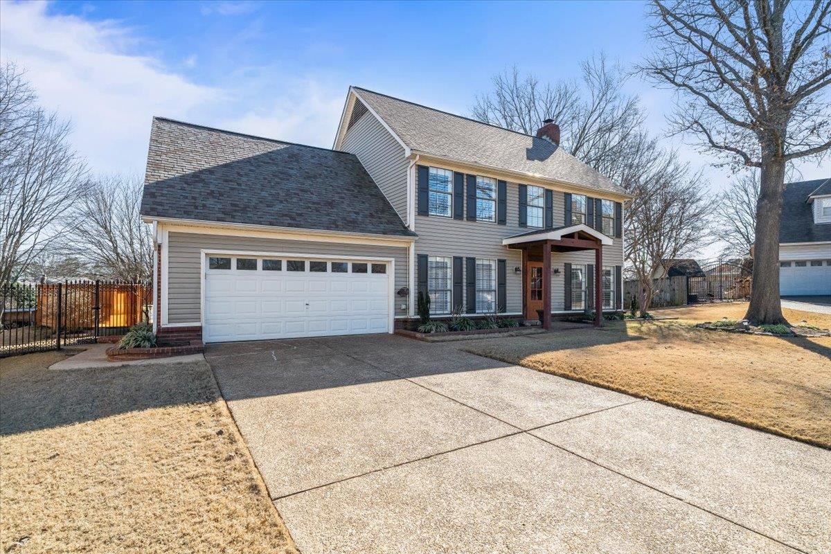 3204 Falling Star Cove Bartlett, TN 38134 - Photo 2 of 36 a view of a white house with a large tree