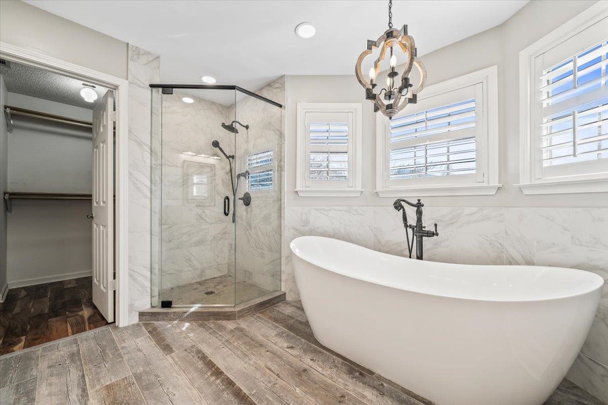 3204 Falling Star Cove Bartlett, TN 38134 - Photo 21 of 36 a white bath tub sitting next to a shower