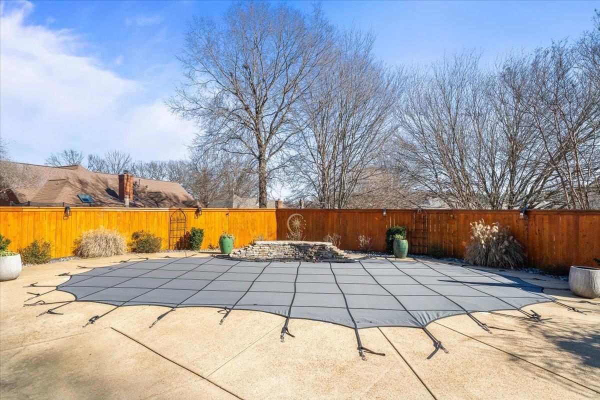 3204 Falling Star Cove Bartlett, TN 38134 - Photo 30 of 36 a view of a swimming pool with an outdoor space and seating area
