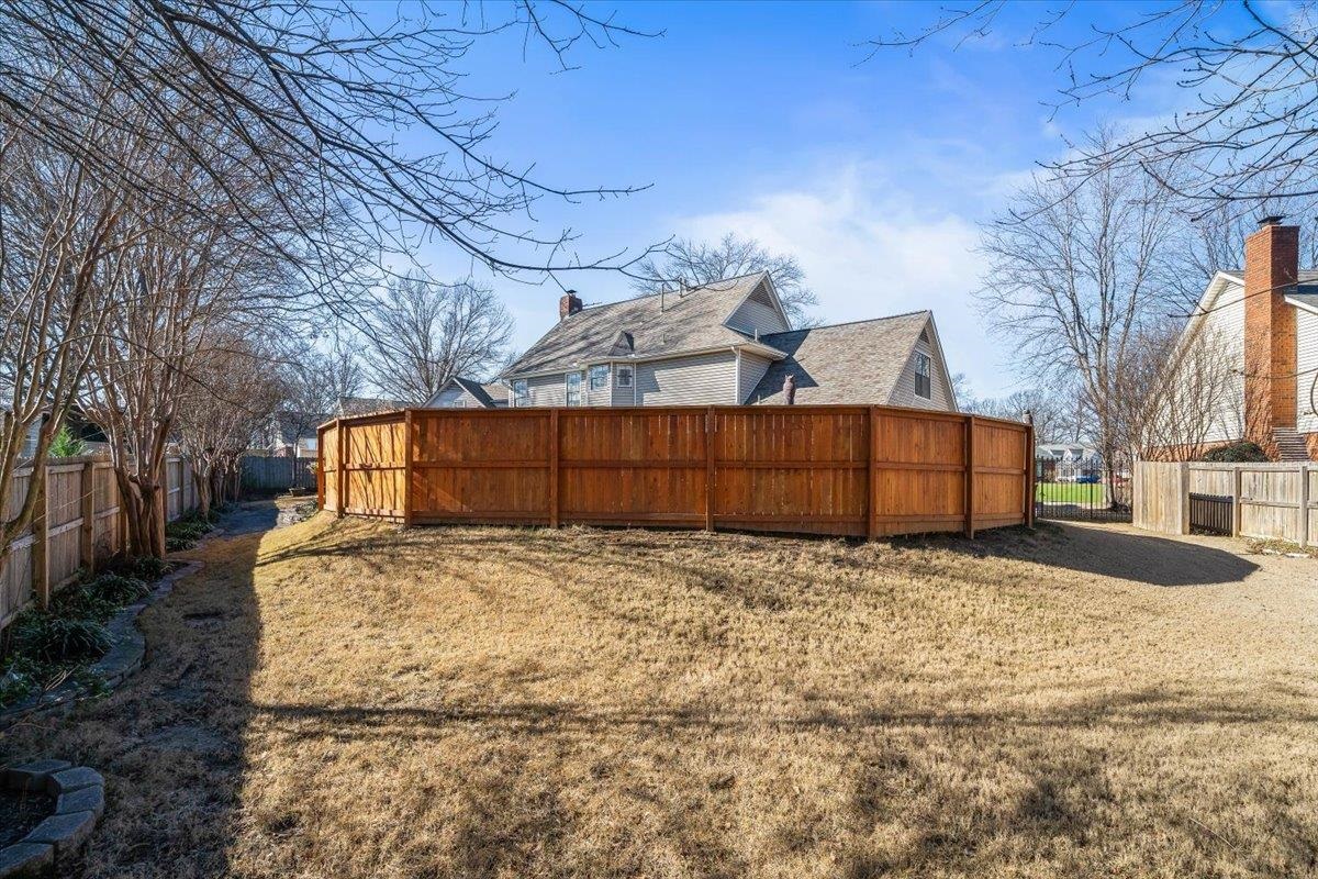 3204 Falling Star Cove Bartlett, TN 38134 - Photo 32 of 36 a view of a yard with large trees