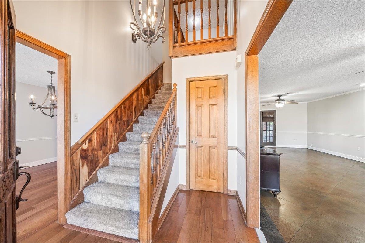 3204 Falling Star Cove Bartlett, TN 38134 - Photo 4 of 36 a view of staircase with wooden floor and staircase