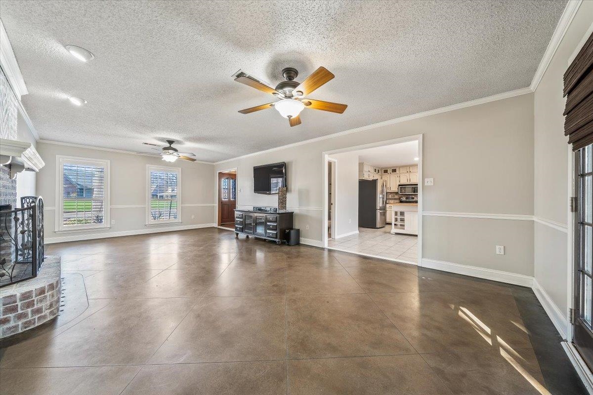 3204 Falling Star Cove Bartlett, TN 38134 - Photo 6 of 36 a view of an empty room with window and a kitchen view