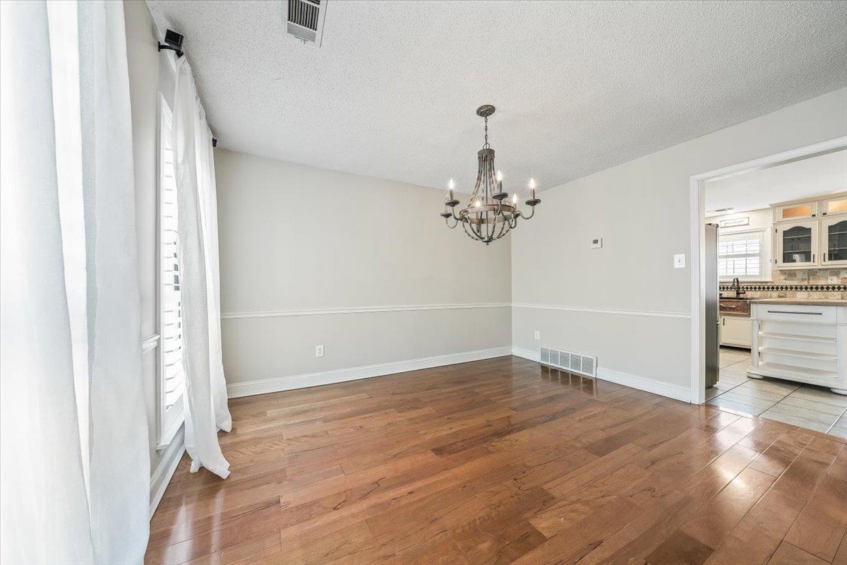 3204 Falling Star Cove Bartlett, TN 38134 - Photo 7 of 36 wooden floor in an empty room with a window