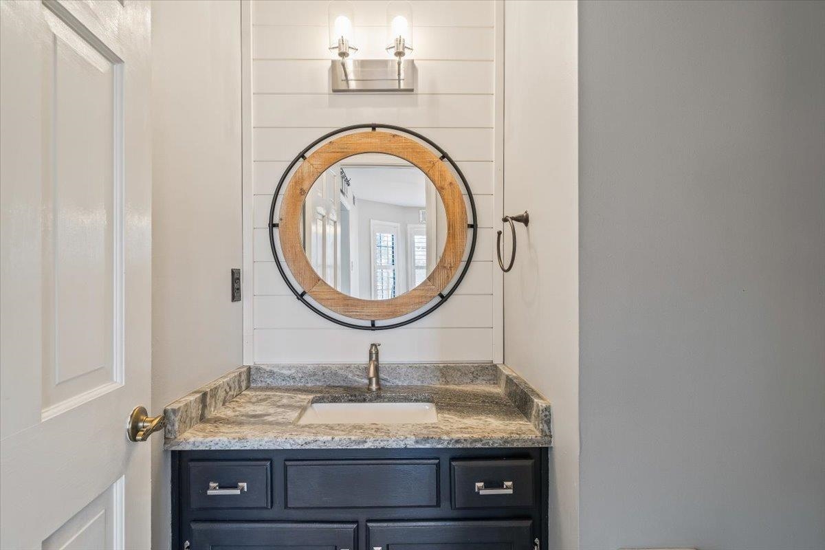 3204 Falling Star Cove Bartlett, TN 38134 - Photo 9 of 36 a bathroom with a granite countertop sink and a mirror