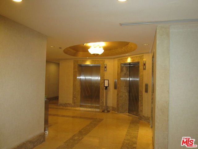 a living room with furniture and a lamp