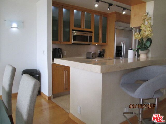 a bedroom with a bed and glass window
