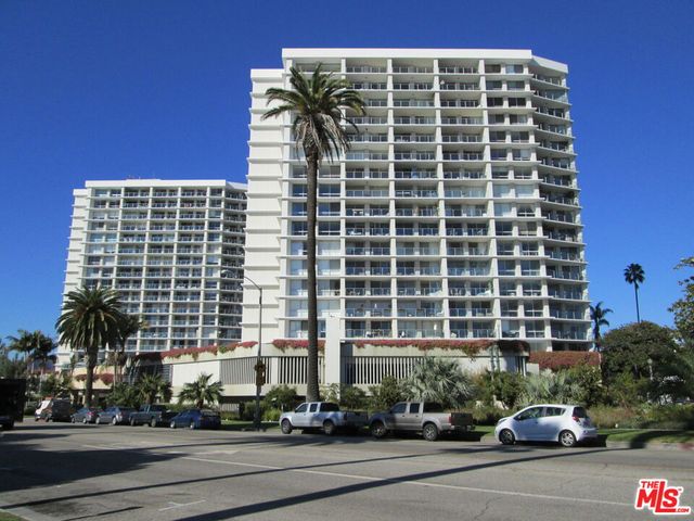 a view of a building with a lot of trees