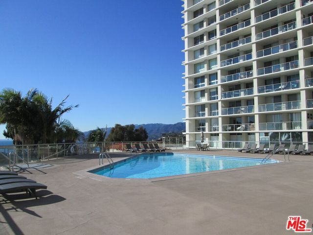 a view of a lobby with black carpet