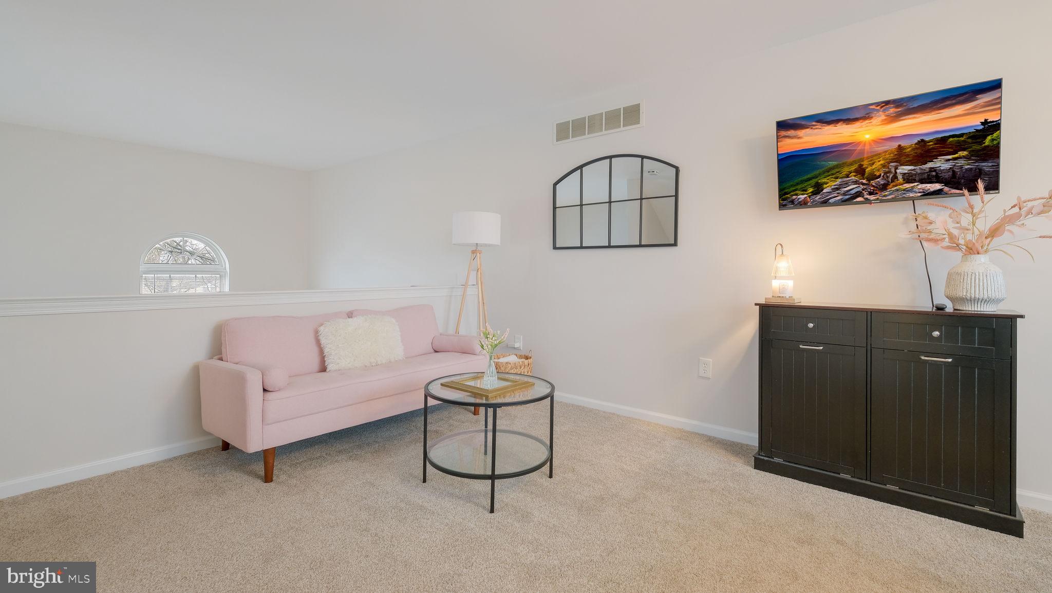 125 Catherine Street, Unit 5 Telford, PA 18969 - Photo 11 of 29 a living room with furniture and a flat screen tv