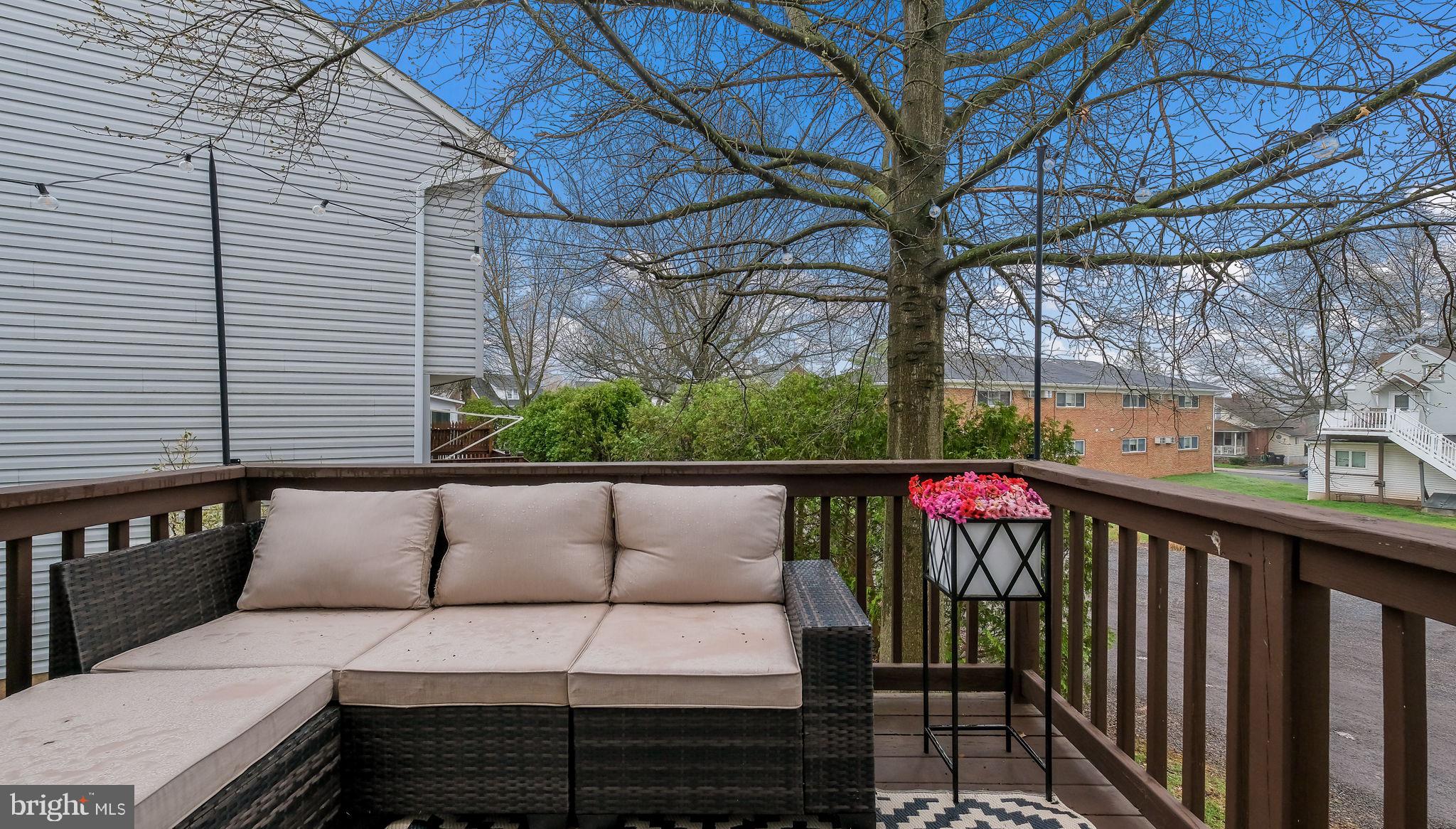 125 Catherine Street, Unit 5 Telford, PA 18969 - Photo 28 of 29 a view of a patio with couches under an umbrella
