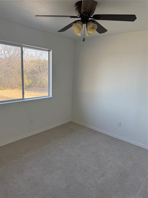 1451 Lakeside Trail Whitney, TX 76692 - Photo 18 of 18 an empty room with a window