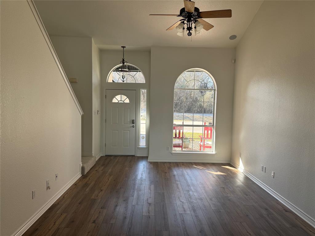 1451 Lakeside Trail Whitney, TX 76692 - Photo 5 of 18 wooden floor in an empty room with a window