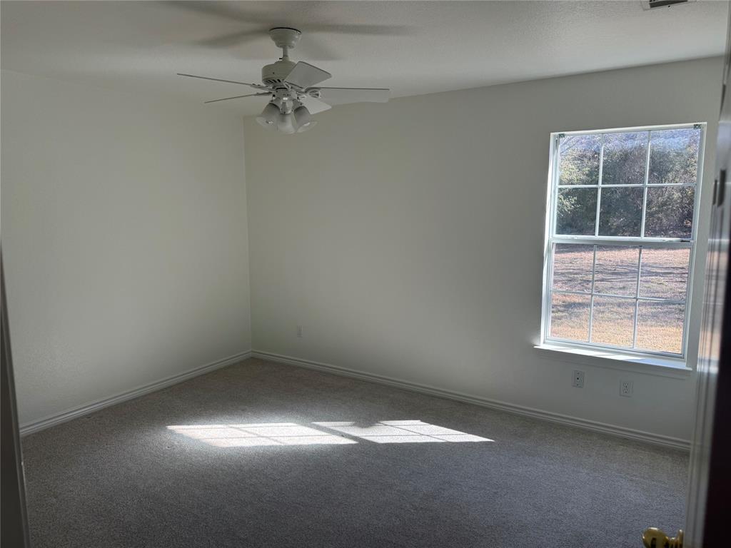 1451 Lakeside Trail Whitney, TX 76692 - Photo 10 of 18 an empty room with a window
