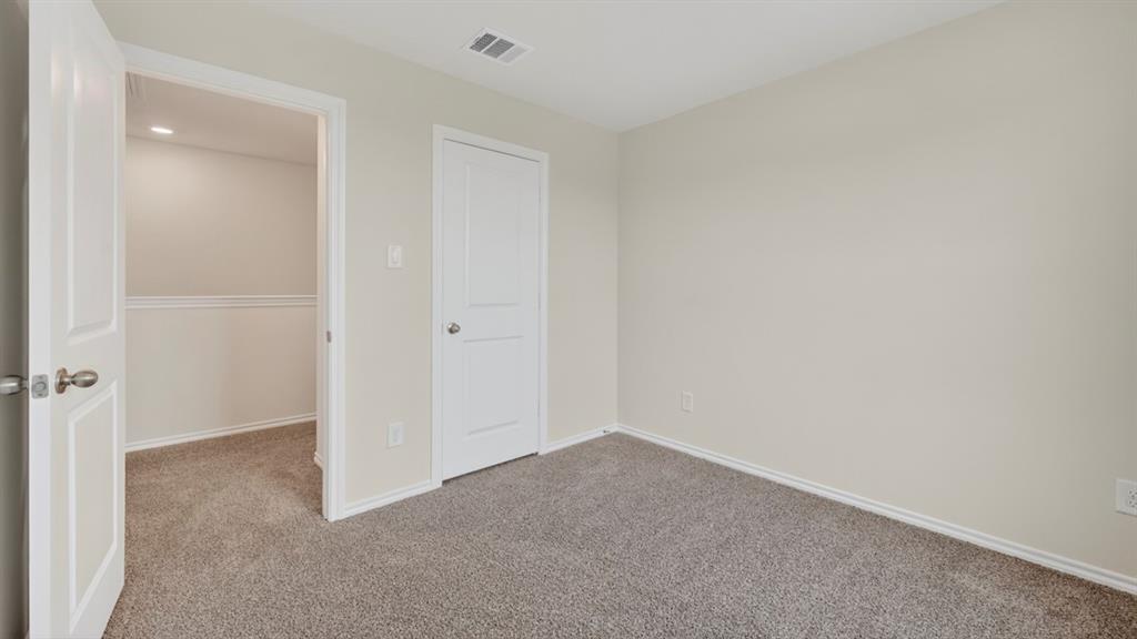 3534 Spring Time Street Forney, TX 75126 - Photo 19 of 24 Room featuring neutral-toned walls, gray carpet, and white trim