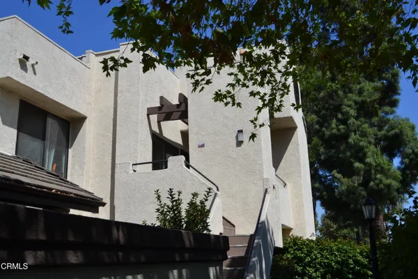 a view of a house with a flower garden