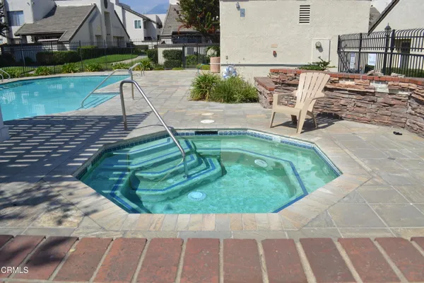 a view of a swimming pool with a patio