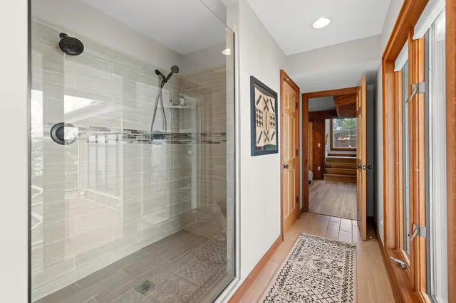 a bathroom with a glass shower door