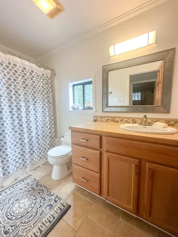 a hallway with a white car parked in front of it