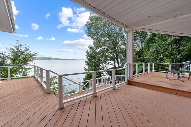a view of a balcony with wooden floor