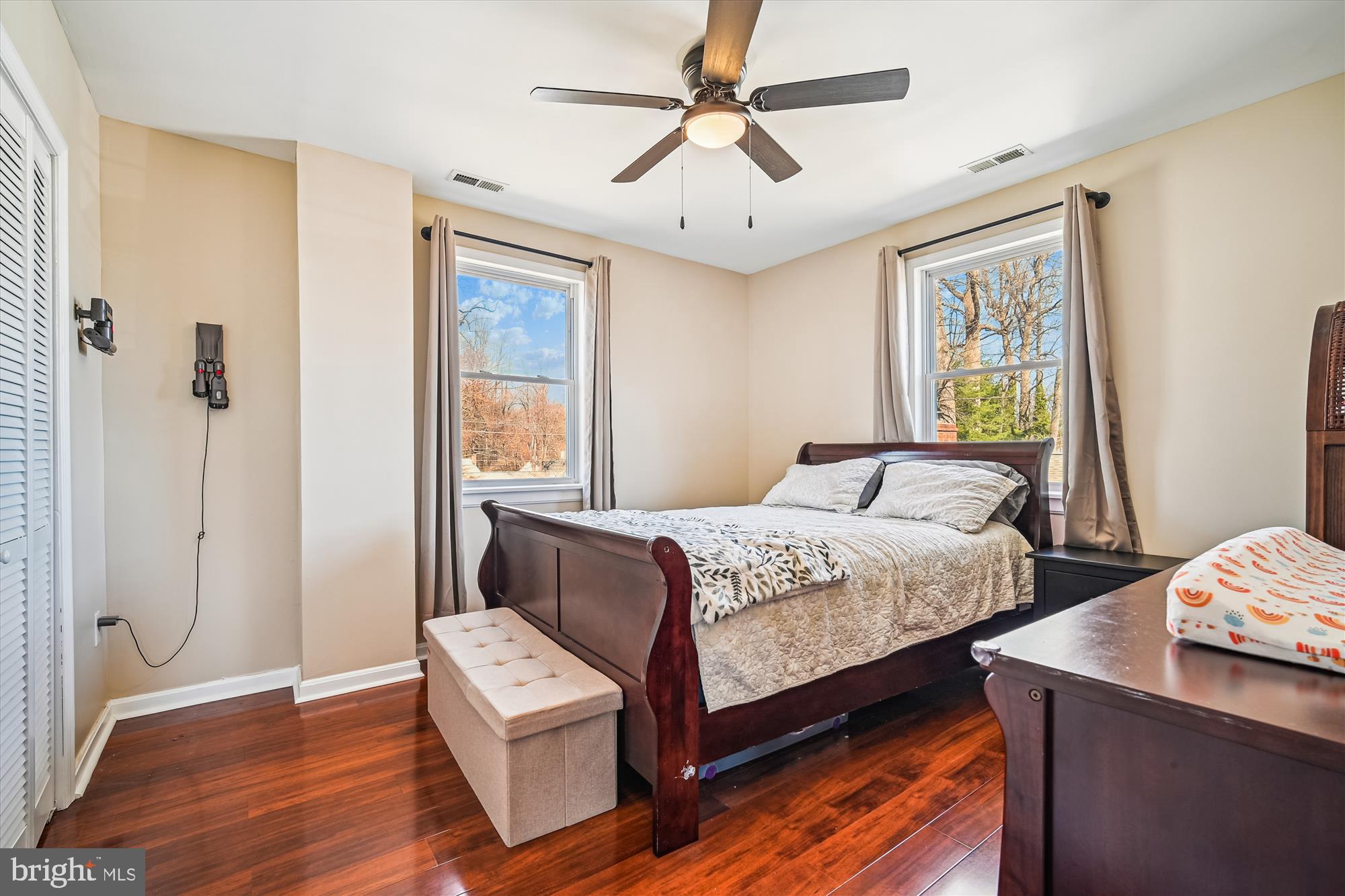 7314 Inzer Street Springfield, VA 22151 - Photo 19 of 37 a bedroom with a bed and wooden floor