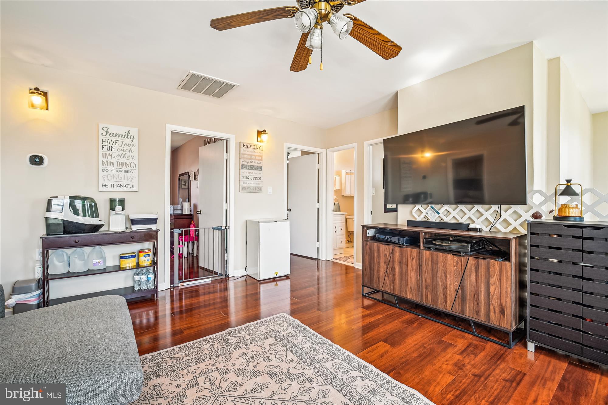 7314 Inzer Street Springfield, VA 22151 - Photo 27 of 37 a living room with furniture and a flat screen tv