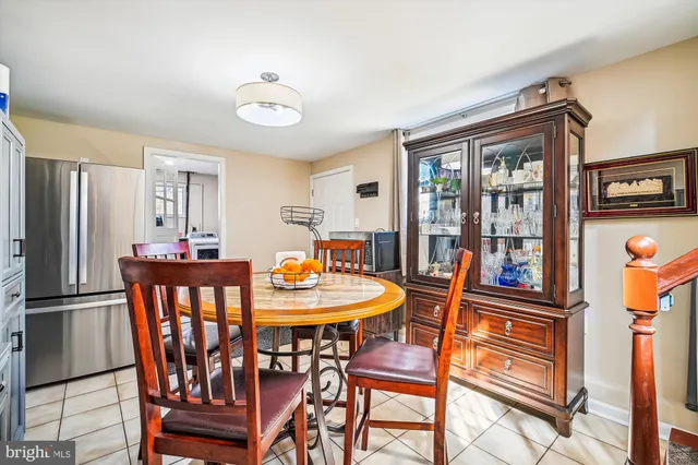 a view of a dining room with furniture and a chandelier